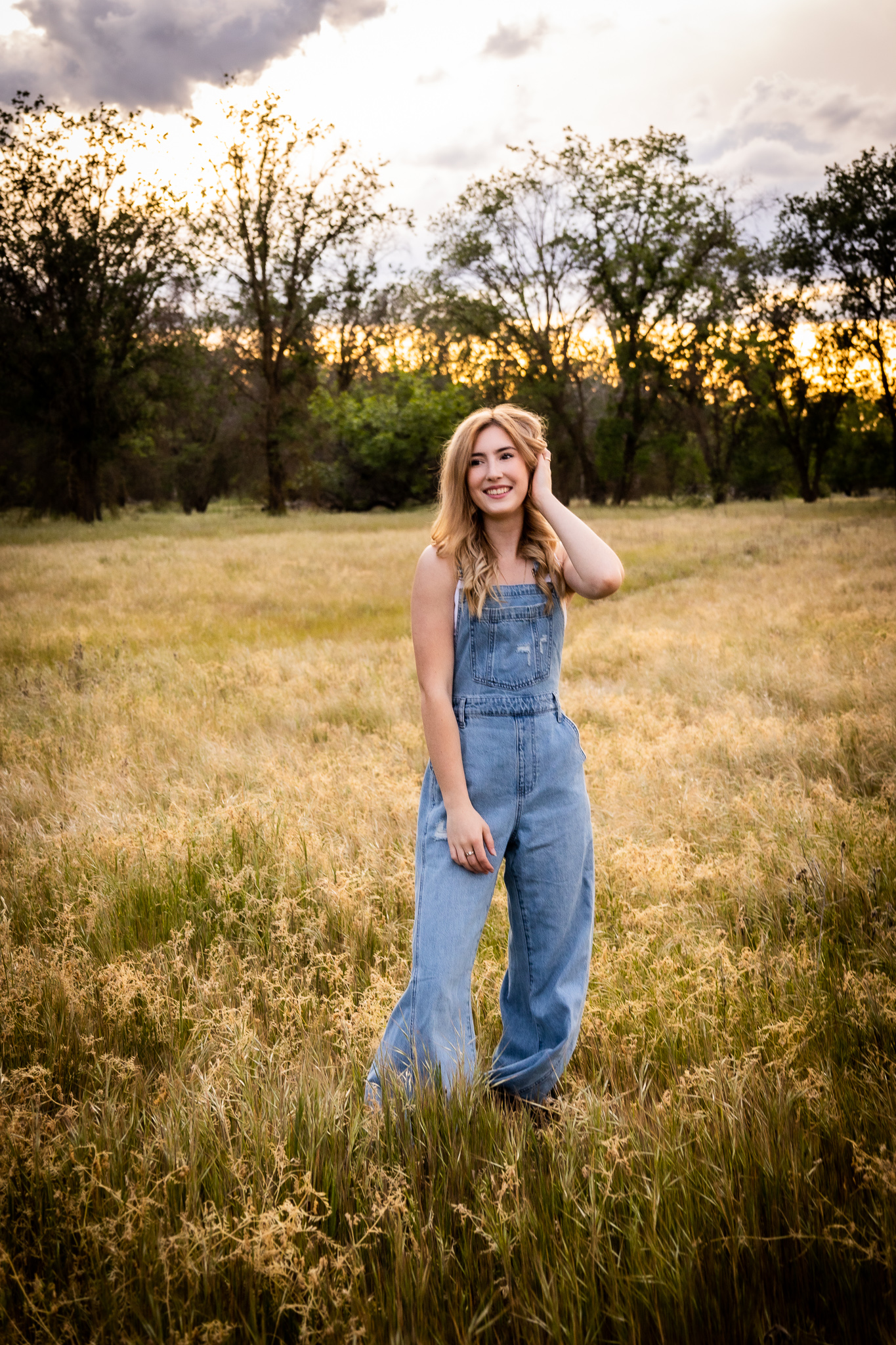 girl in overalls during red bluff ca spring senior session