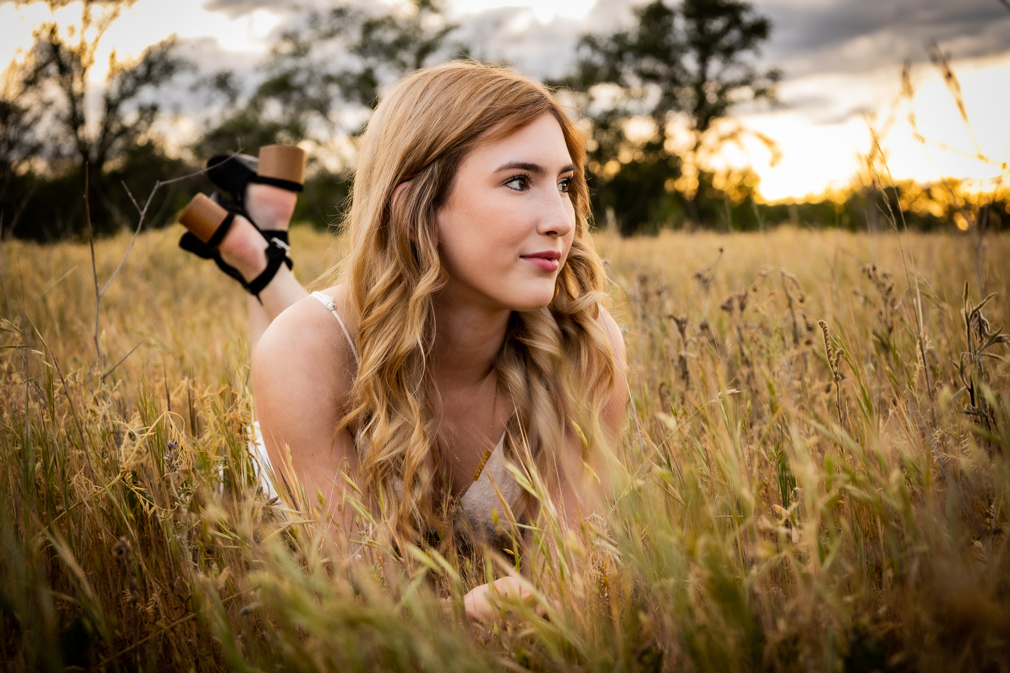 girl laying in field in red bluff ca during senior session