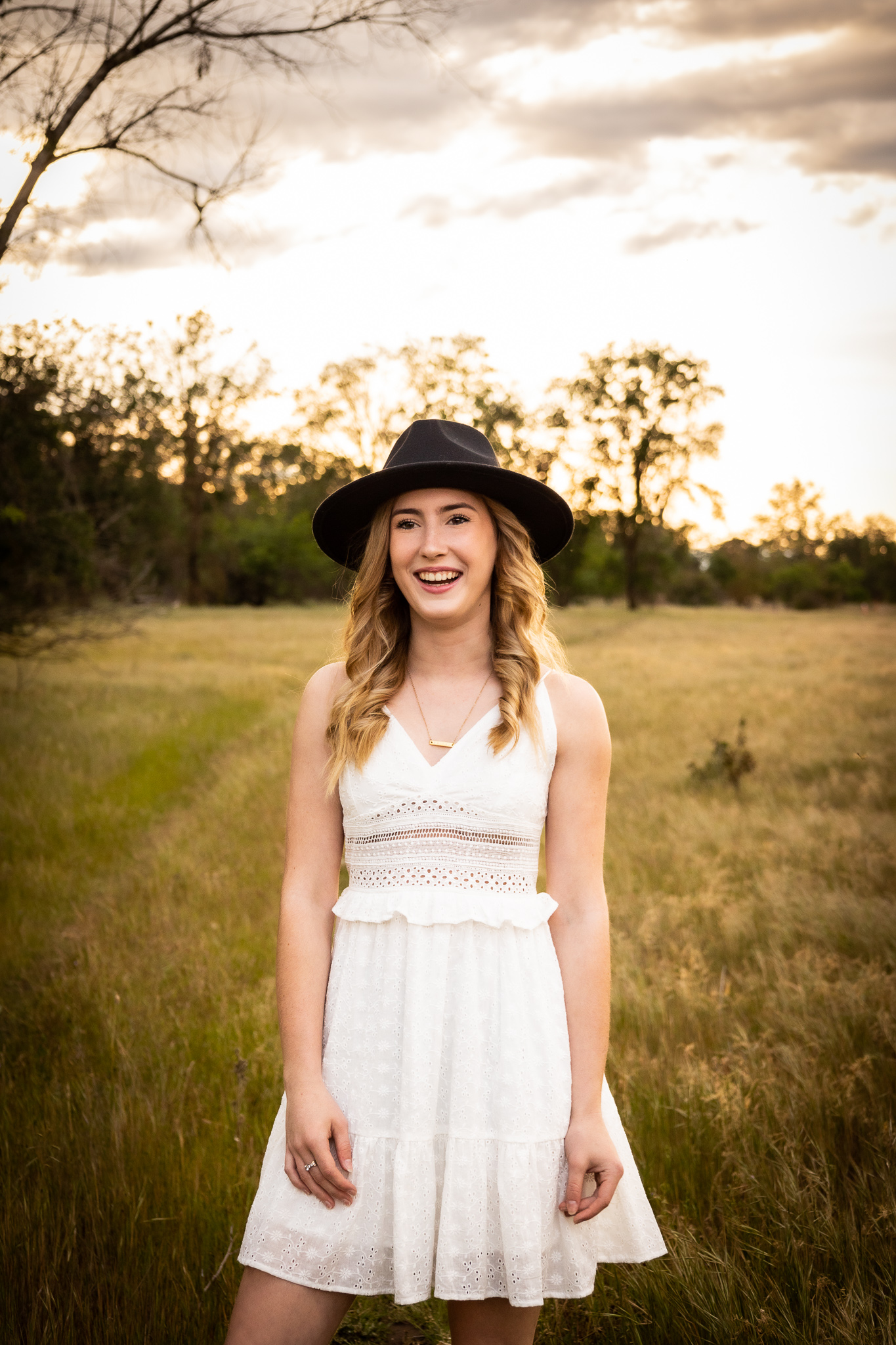 girl wearing black hat during senior session in red bluff ca