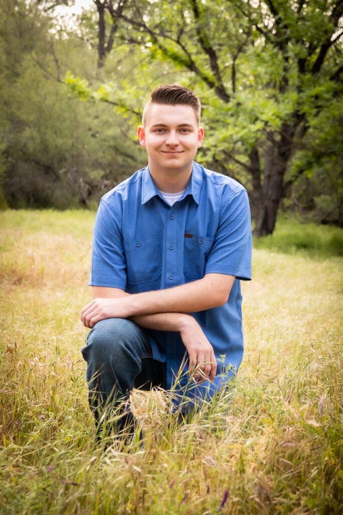 MAN IN KNEALING IN BLUE SHIRT IN RED BLUFF CA