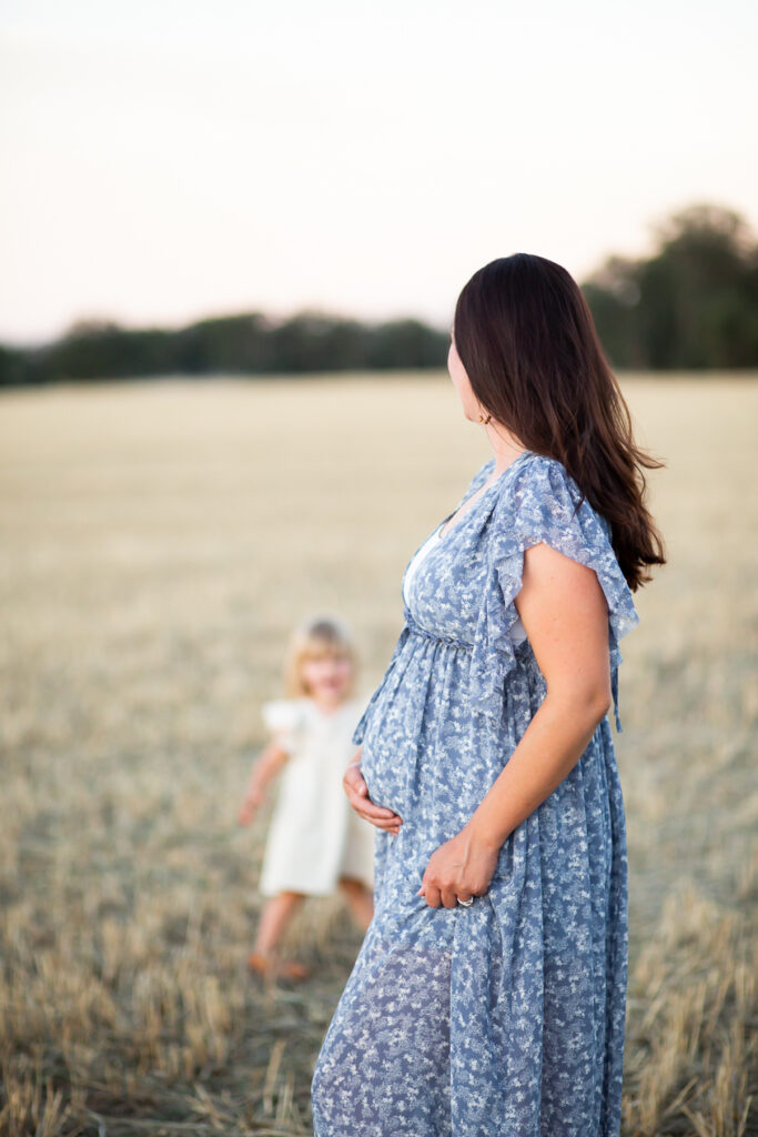 pregnant woman wearing blue maternity dress