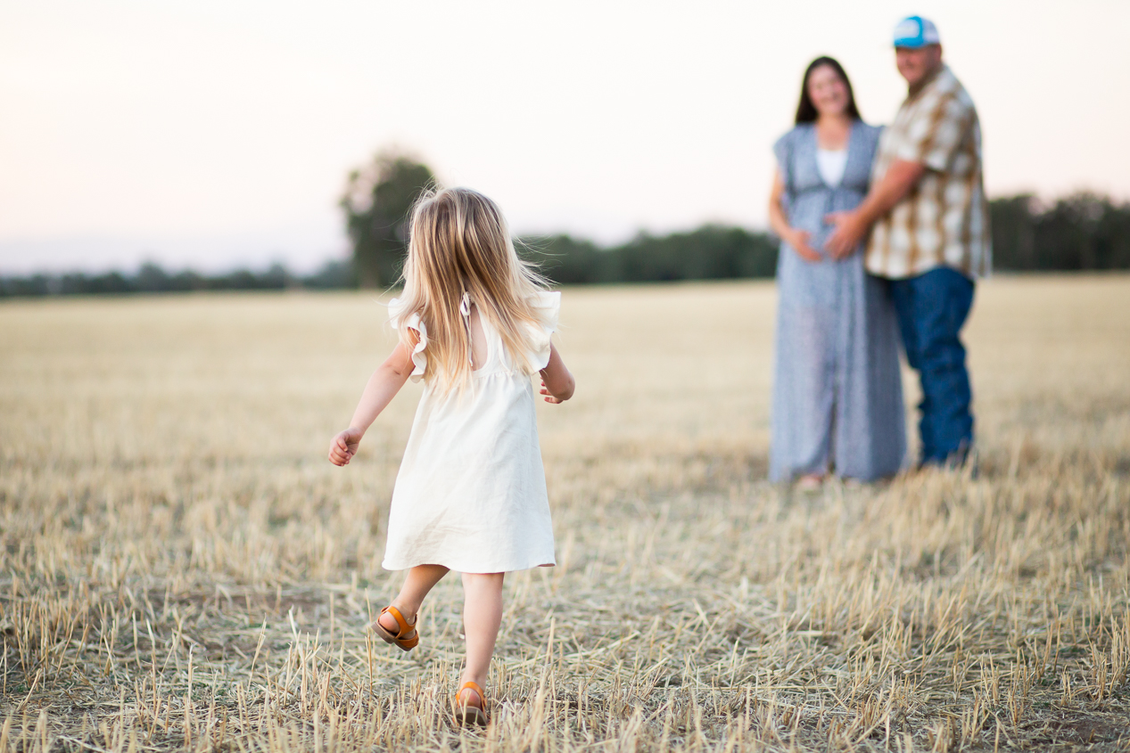 family running in hayfield 