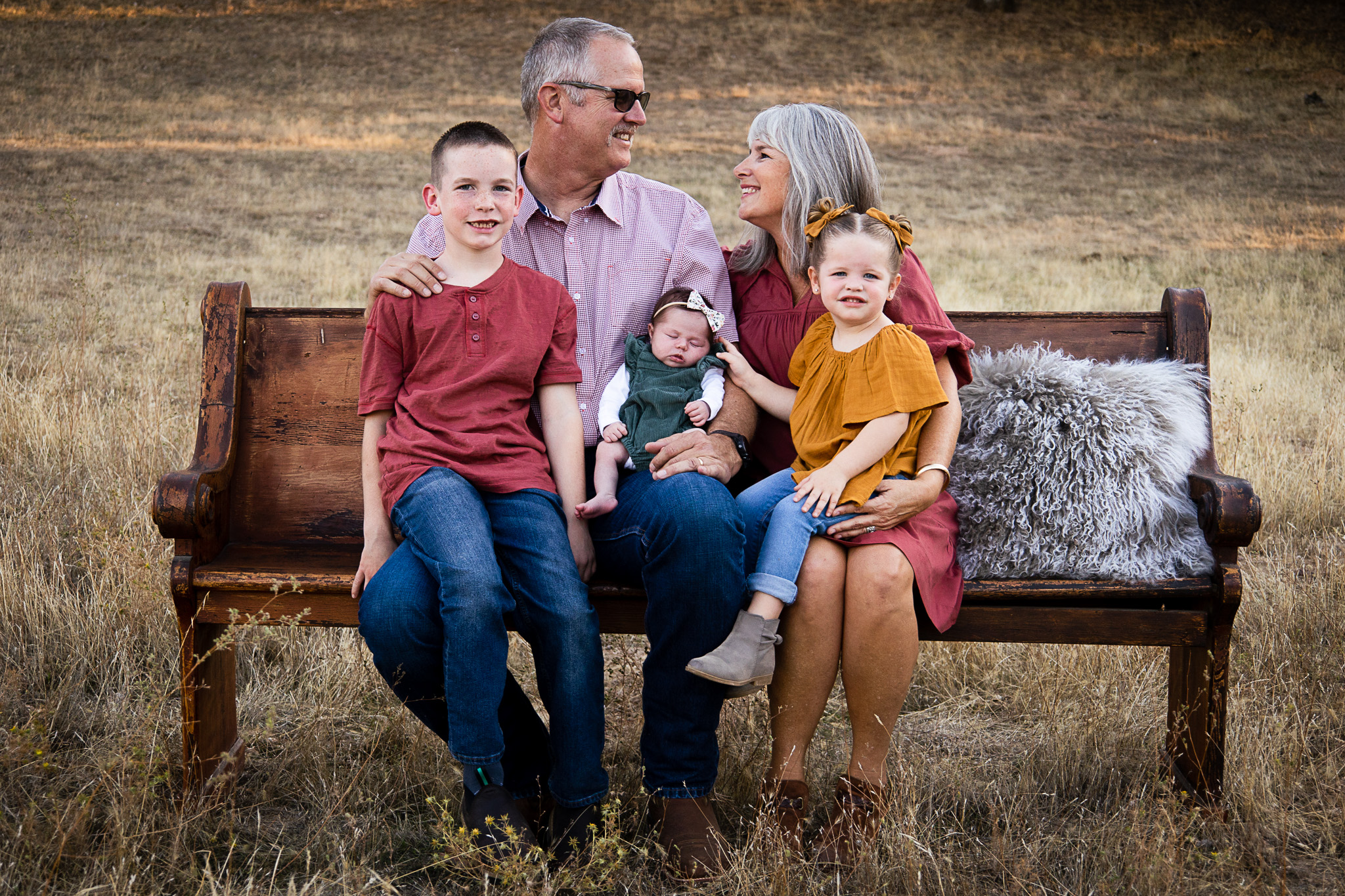 grandparents with grandkids on church pew