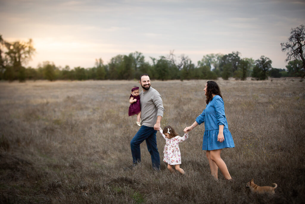 family running through open field