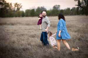 family running through field