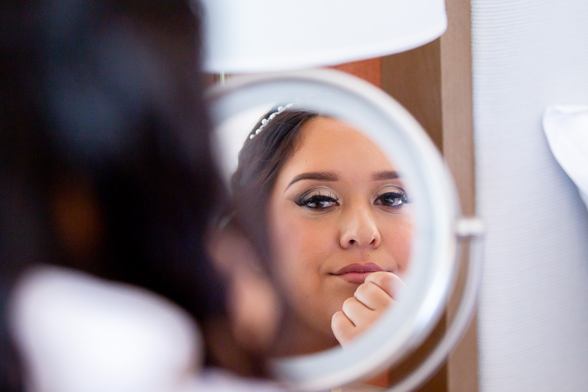 bride looking in mirror