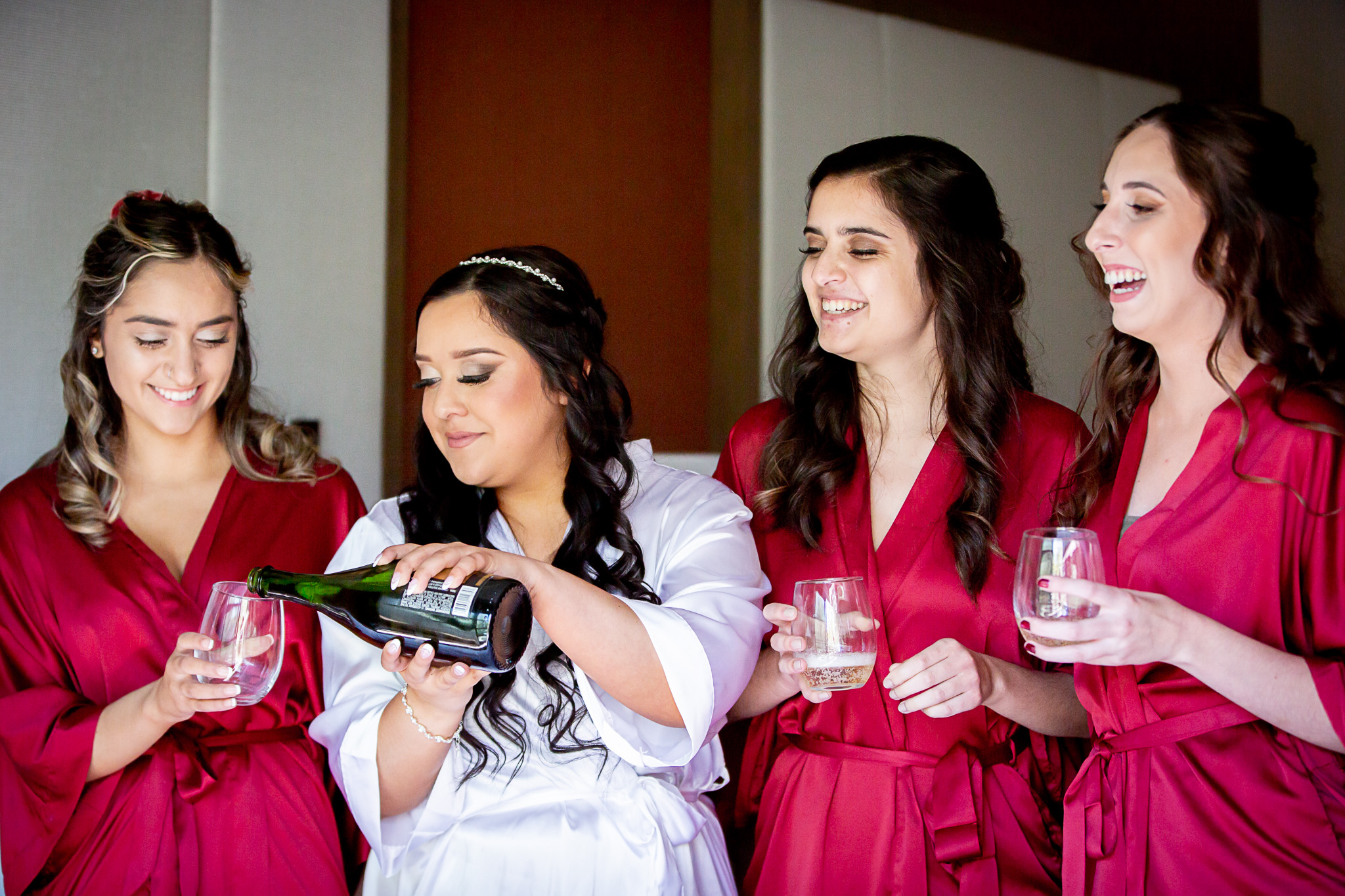 bridesmaids drinking champagne