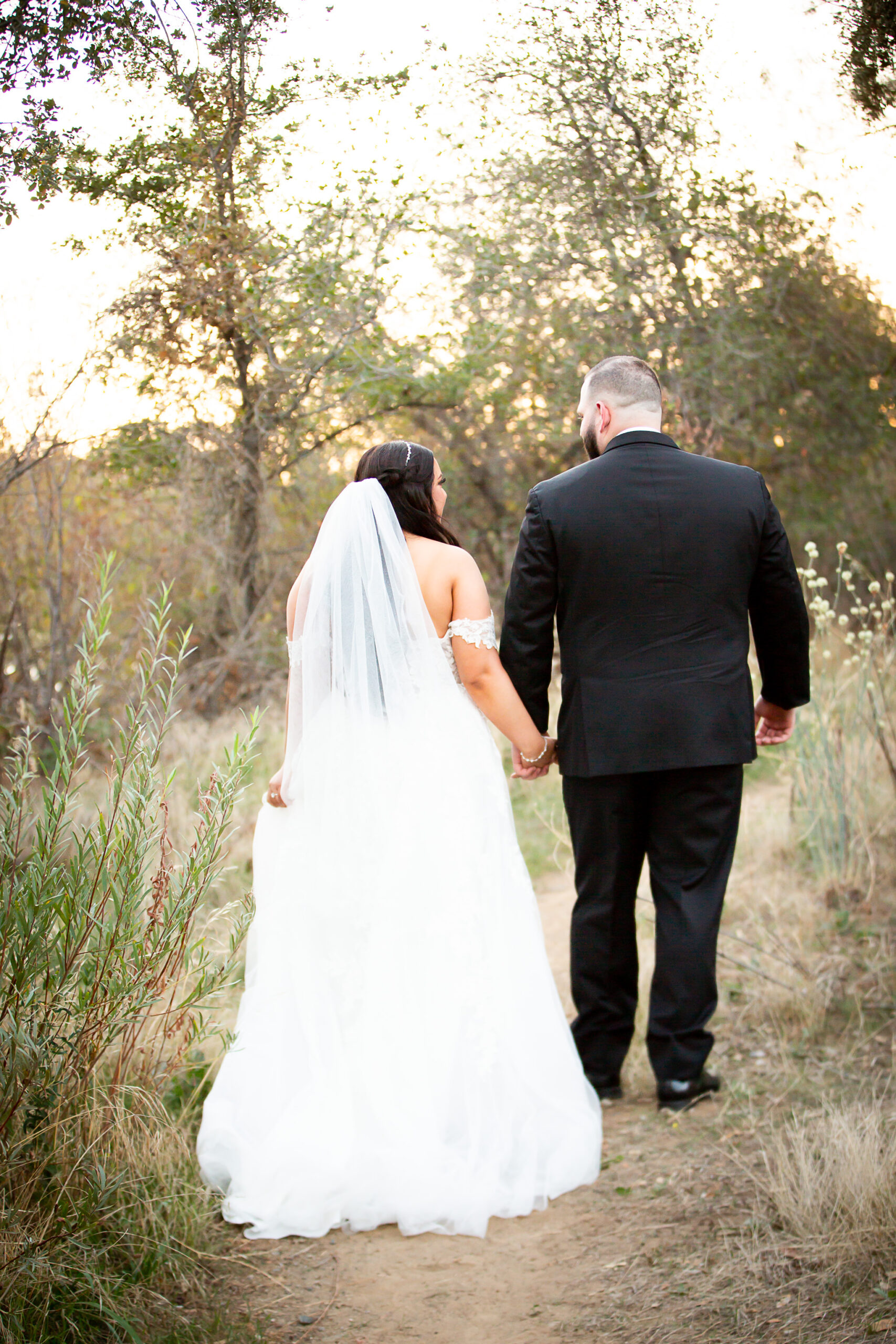 bride and groom walking away