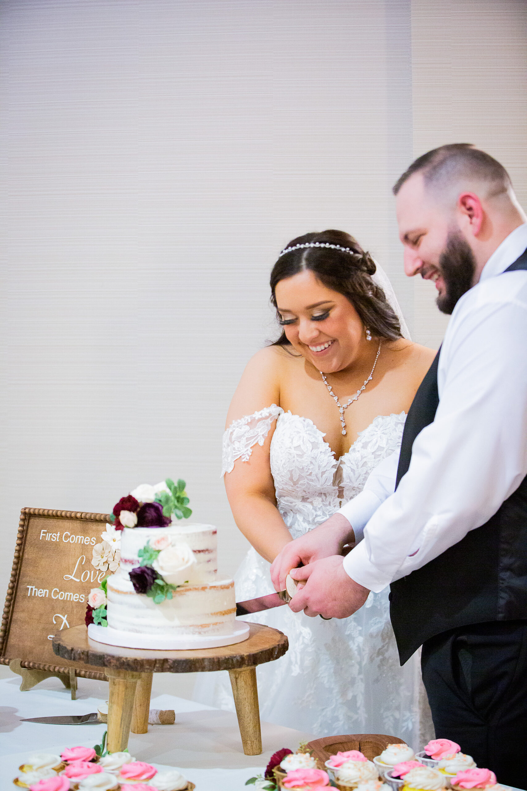 bride and groom cutting cake