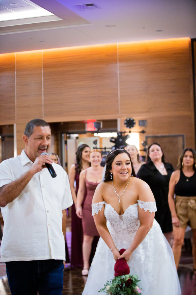 bride throwing bouquet