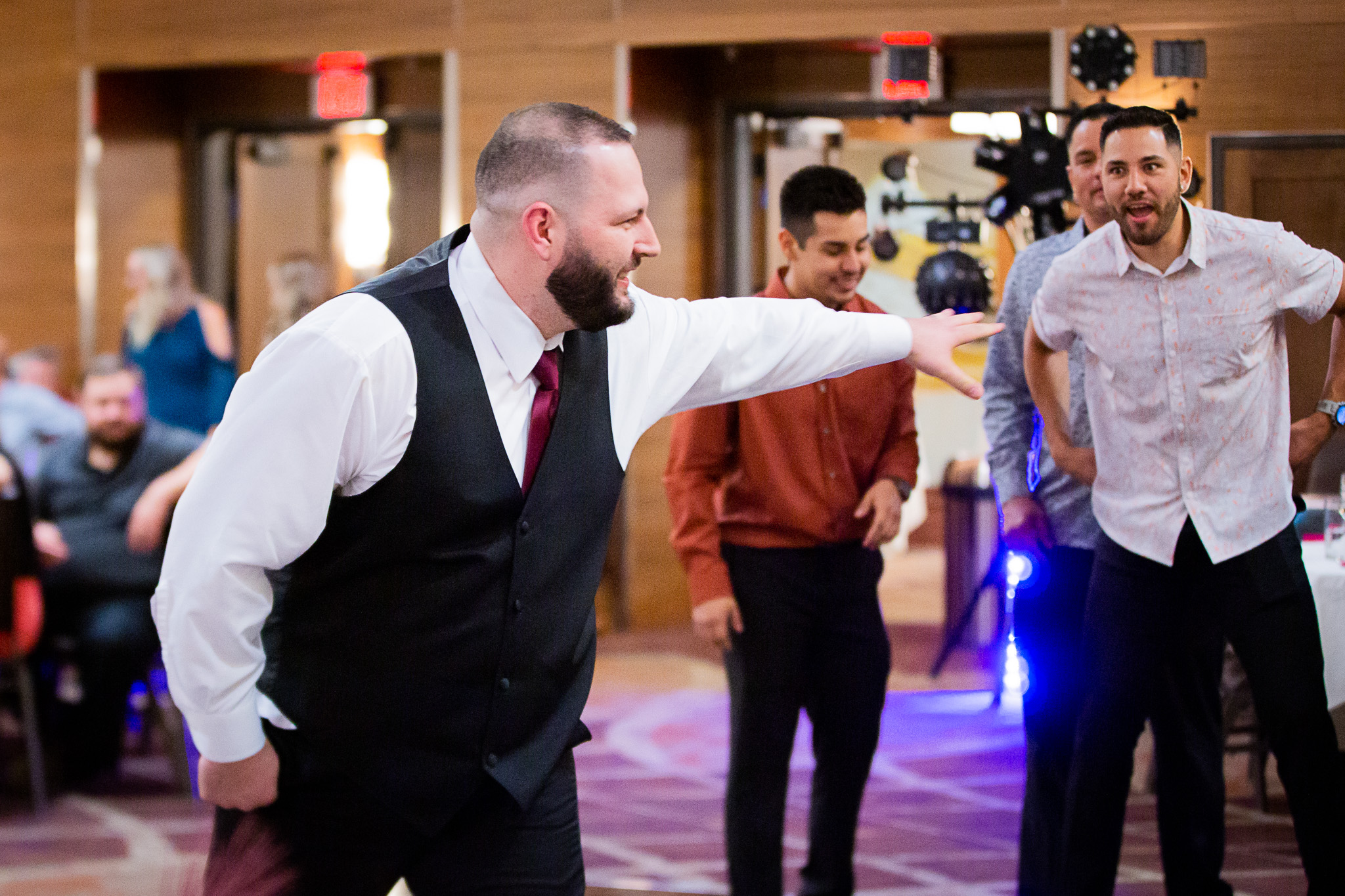 groom pointing at guys
