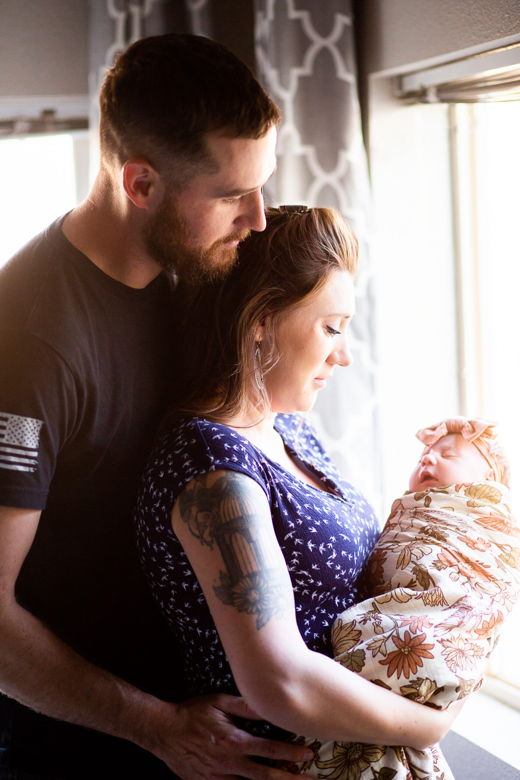 mom and dad holding newborn in red bluff lifestyle newborn session