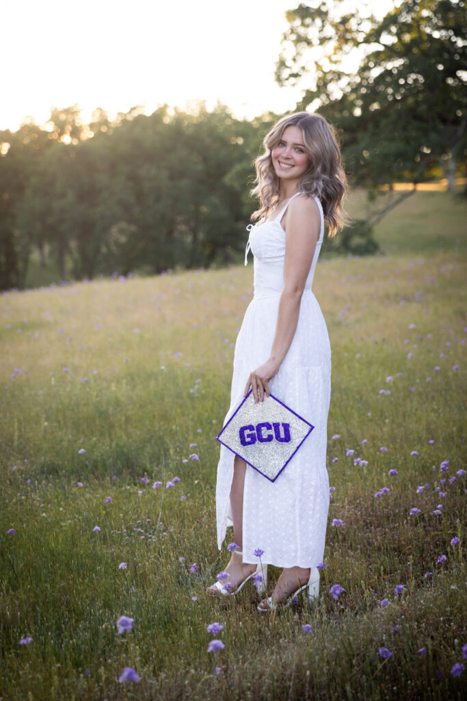 girl holding Grand Canyon university cap from red bluff ca