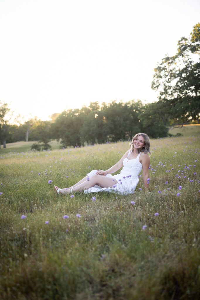 girl sitting in field