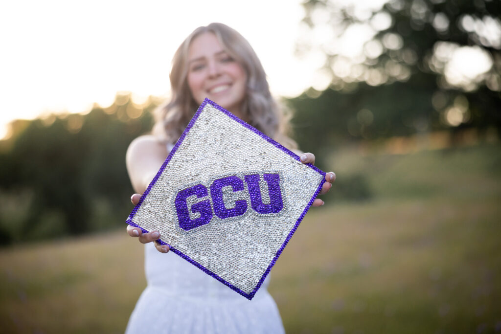 girl holding graduation cap for Grand Canyon university from red bluff ca