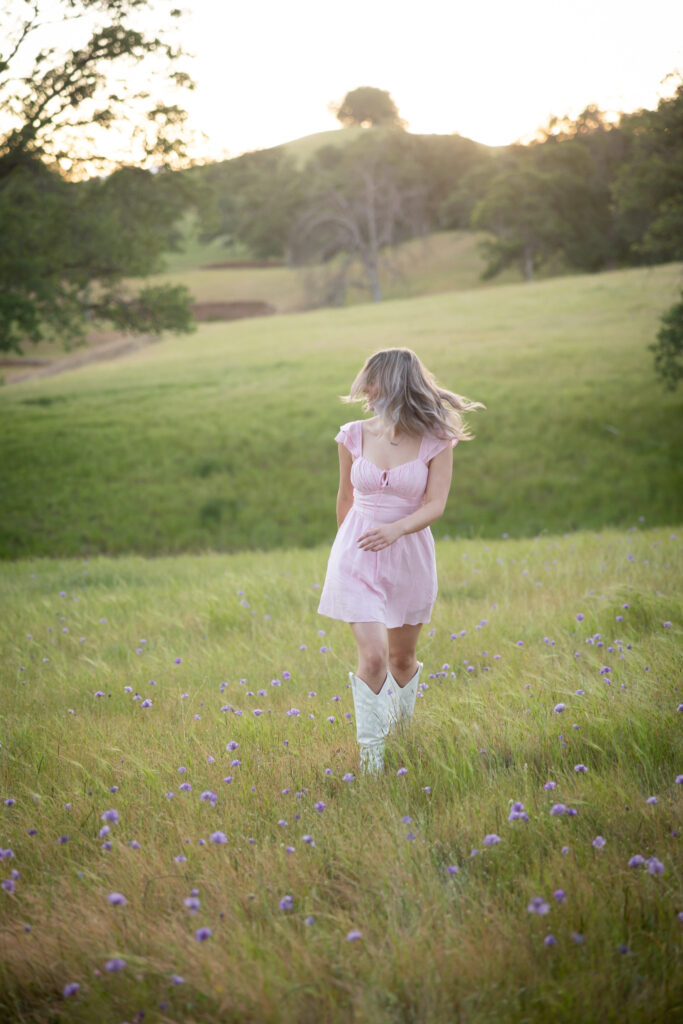 girl walking up hill during senior session